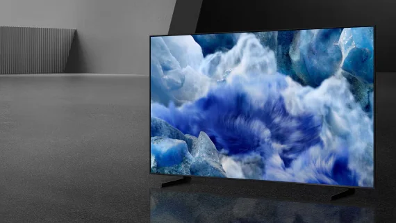 An LED television showing a blue and white abstract scene